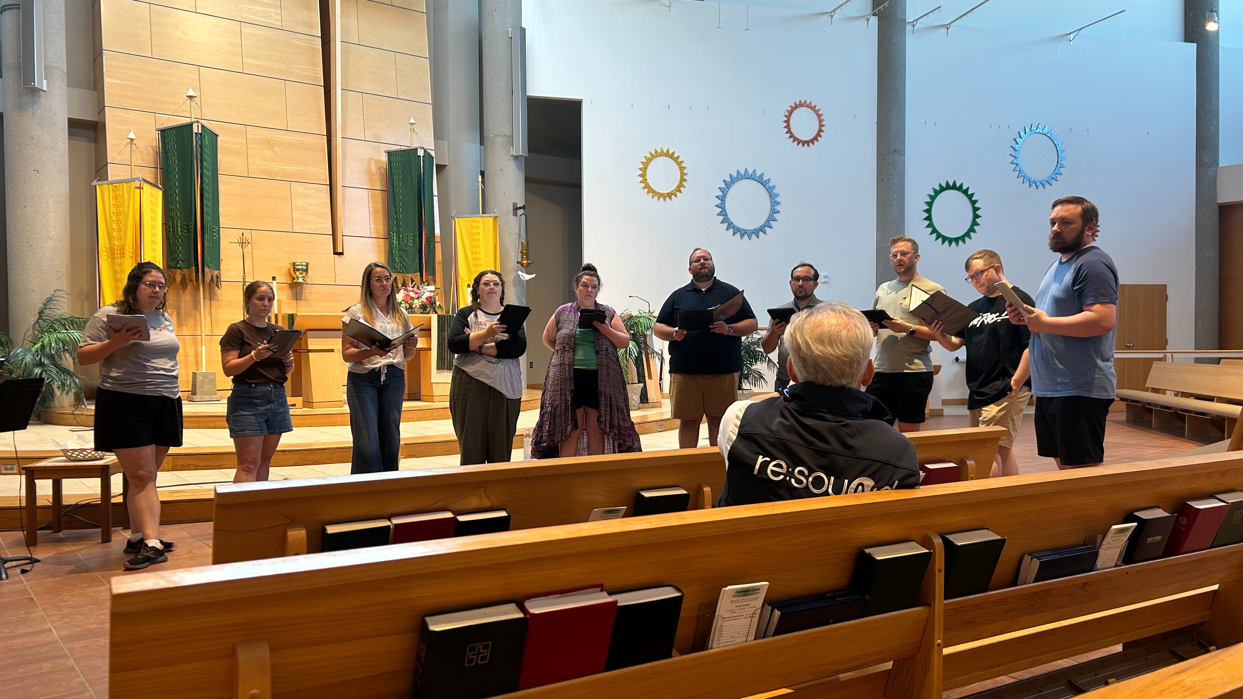 Choir rehearsing in a semicircle in a church